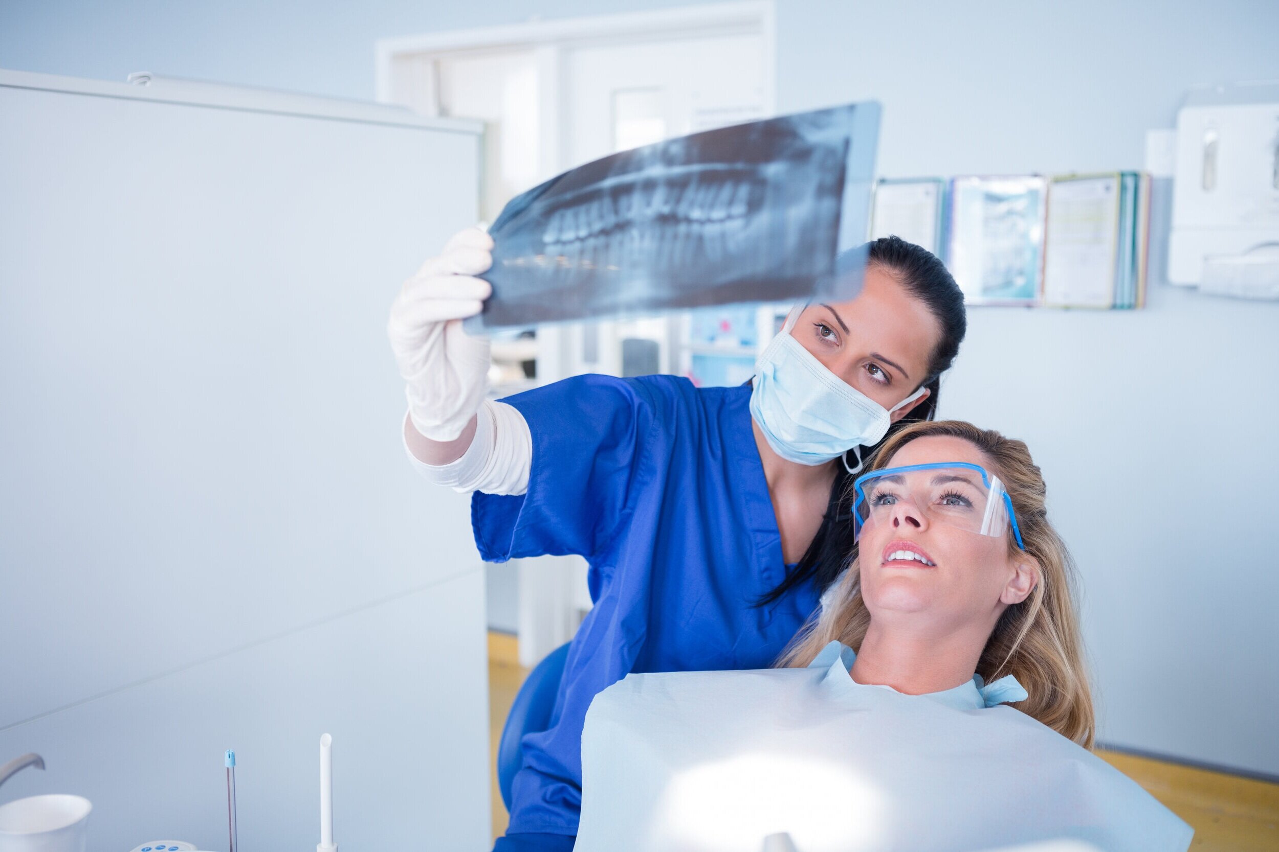 Dentist_Ashburn_VA_Dentist_explaining_x-ray_to_patient Dentist_Ashburn_VA_Dentist_explaining_x-ray_to_patient